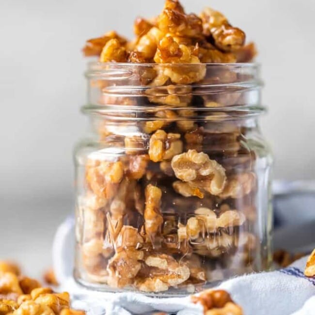 Candied Walnuts are awesome for holiday appetizers, baking, snacking, and so much more. This Easy  Candied Walnuts Recipe is made in under 5 minutes and oh so tasty! Caramelized Walnuts are such a healthy snack including vitamin E, healthy fats, and antioxidants. We will show you How to Make Candied Walnuts, the perfect snack!