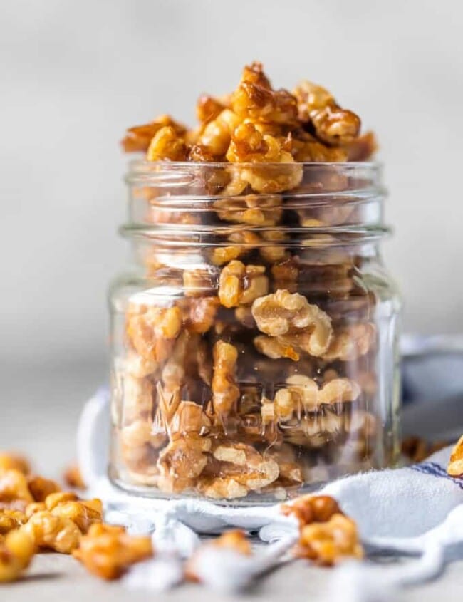 Candied Walnuts are awesome for holiday appetizers, baking, snacking, and so much more. This Easy  Candied Walnuts Recipe is made in under 5 minutes and oh so tasty! Caramelized Walnuts are such a healthy snack including vitamin E, healthy fats, and antioxidants. We will show you How to Make Candied Walnuts, the perfect snack!