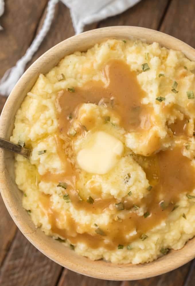 a bowl of mashed potatoes topped with homemade gravy