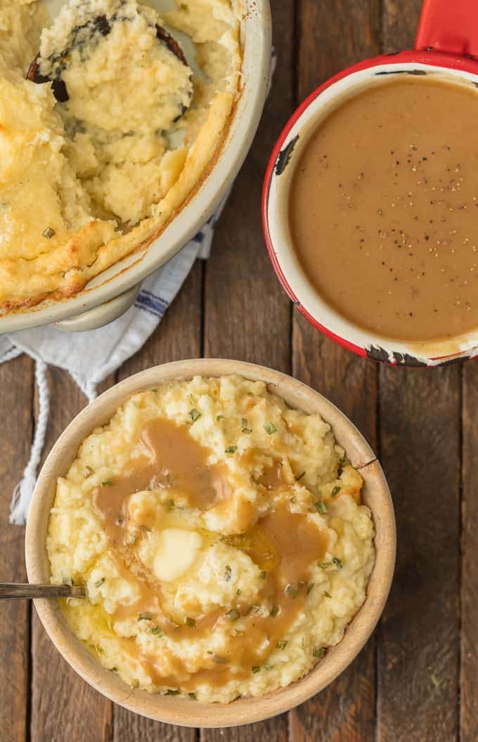 Easy Gravy Recipe in a red bowl, next to a bowl of mashed potatoes topped with gravy