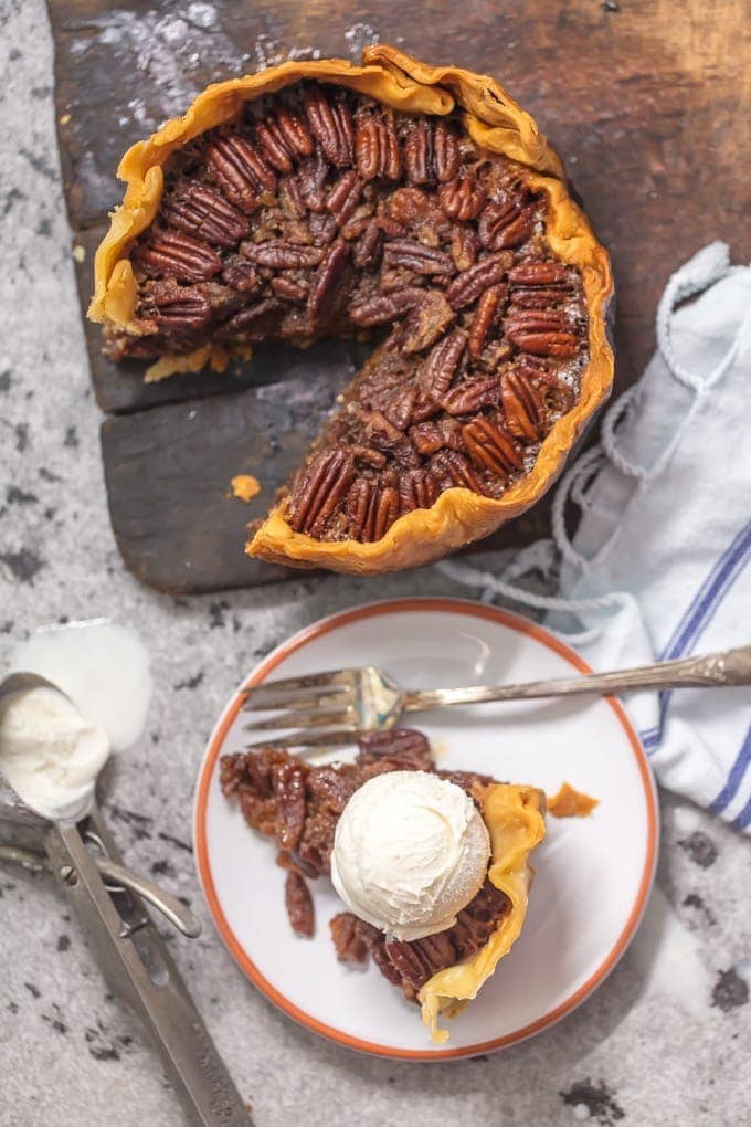 Crock Pot Pecan Pie is such an EASY Pecan Pie Recipe, you won't believe you taste buds! This SLOW COOKER PECAN PIE will knock your socks off and make for a delicious and easy Thanksgiving, Christmas, or Easter! This is the BEST Pecan Pie Recipe we have ever tasted, and it just so happened to be made in a slow cooker. Win win!