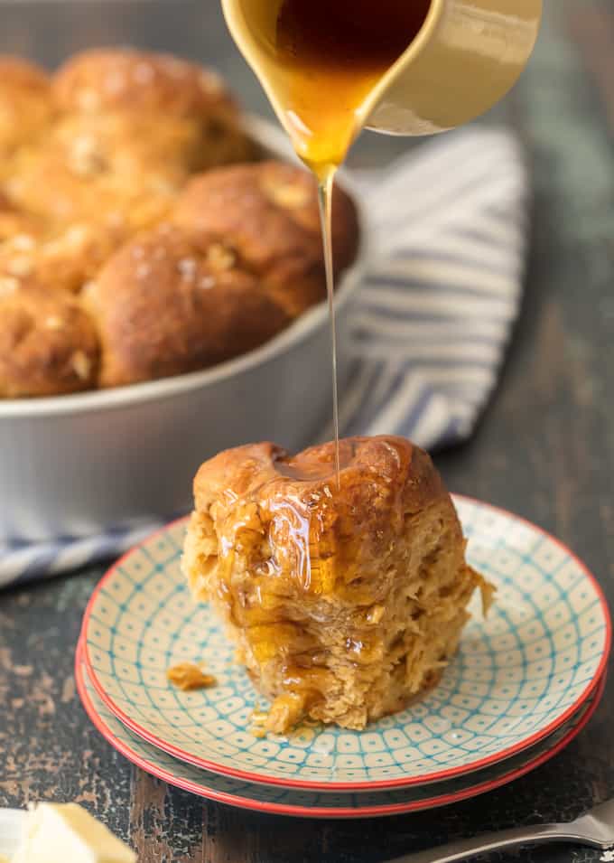 pouring honey onto a roll