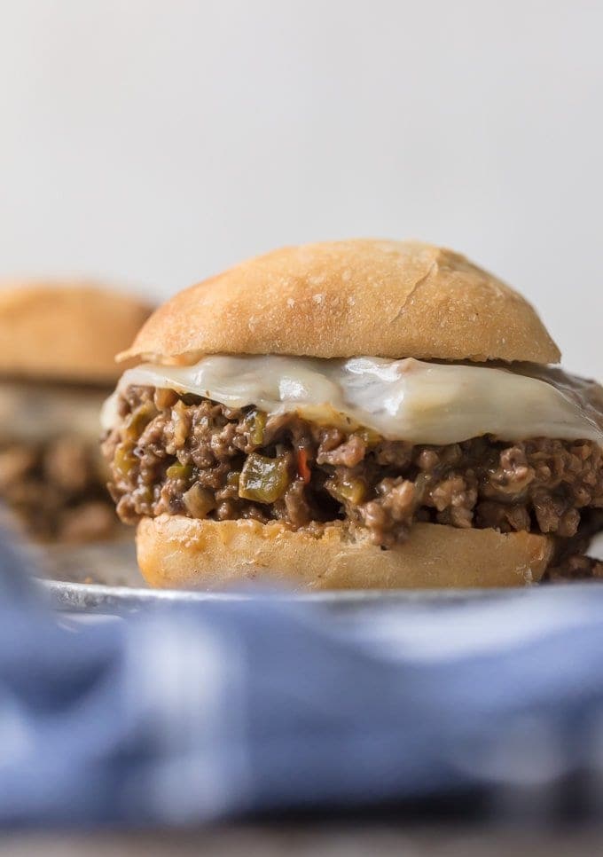 philly cheesesteak sloppy joes on a plate with cheese