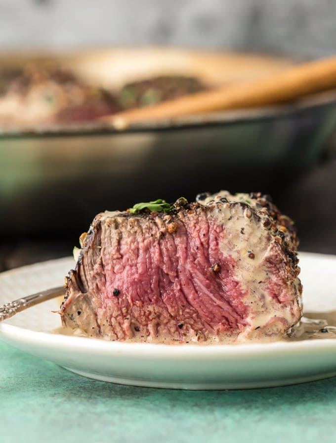 piece of steak cut to reveal medium rare interior