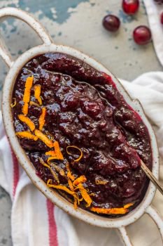 This Homemade Cranberry Sauce Recipe with Orange Liqueur is our favorite fresh cranberry sauce to make for Thanksgiving! This SPIKED CRANBERRY SAUCE is a fun twist on a classic Thanksgiving recipe. No holiday table is complete without cranberry sauce, and this easy Homemade Cranberry Sauce is extra delicious and amazing! We call them "sauced" cranberries.