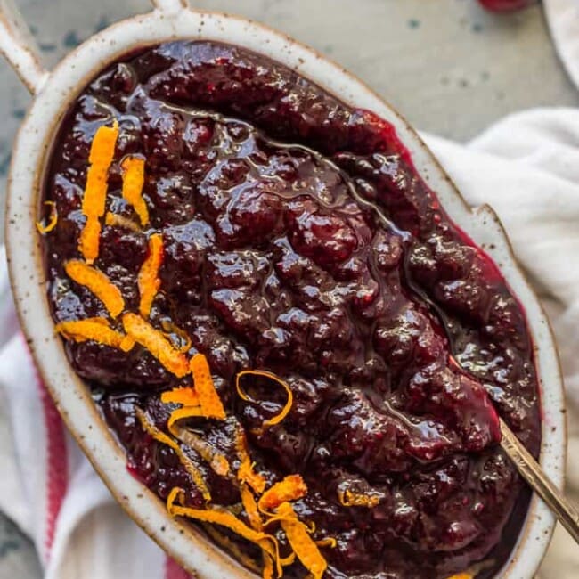 This Homemade Cranberry Sauce Recipe with Orange Liqueur is our favorite fresh cranberry sauce to make for Thanksgiving! This SPIKED CRANBERRY SAUCE is a fun twist on a classic Thanksgiving recipe. No holiday table is complete without cranberry sauce, and this easy Homemade Cranberry Sauce is extra delicious and amazing! We call them "sauced" cranberries.