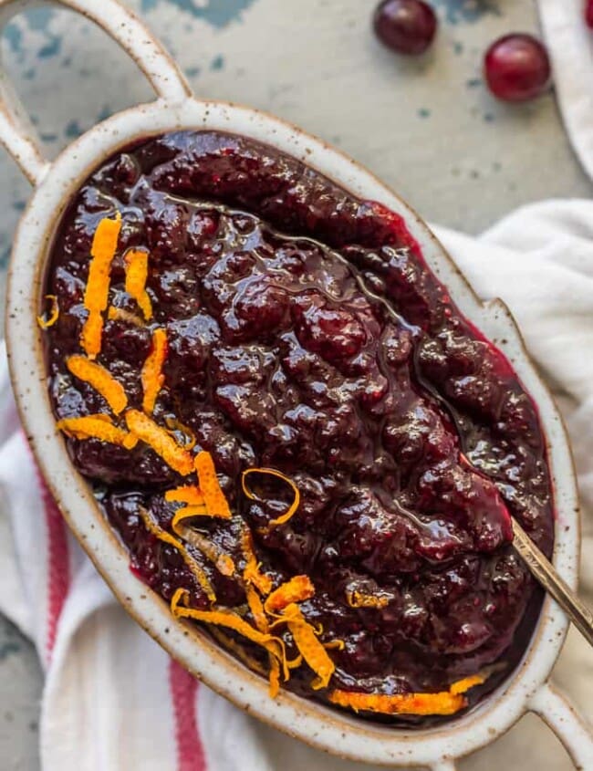 This Homemade Cranberry Sauce Recipe with Orange Liqueur is our favorite fresh cranberry sauce to make for Thanksgiving! This SPIKED CRANBERRY SAUCE is a fun twist on a classic Thanksgiving recipe. No holiday table is complete without cranberry sauce, and this easy Homemade Cranberry Sauce is extra delicious and amazing! We call them "sauced" cranberries.