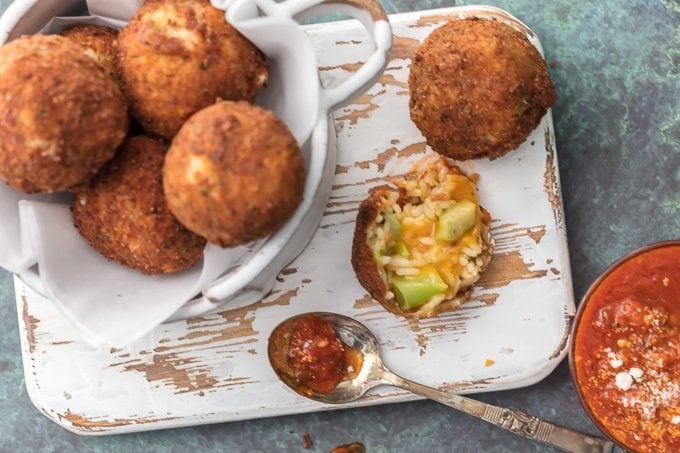 One of our favorite comfort food appetizers is BACON BROCCOLI CHEESE ARANCINI! These cheesy fried rice balls are the ultimate starter to any meal at home. So addicting and delicious!