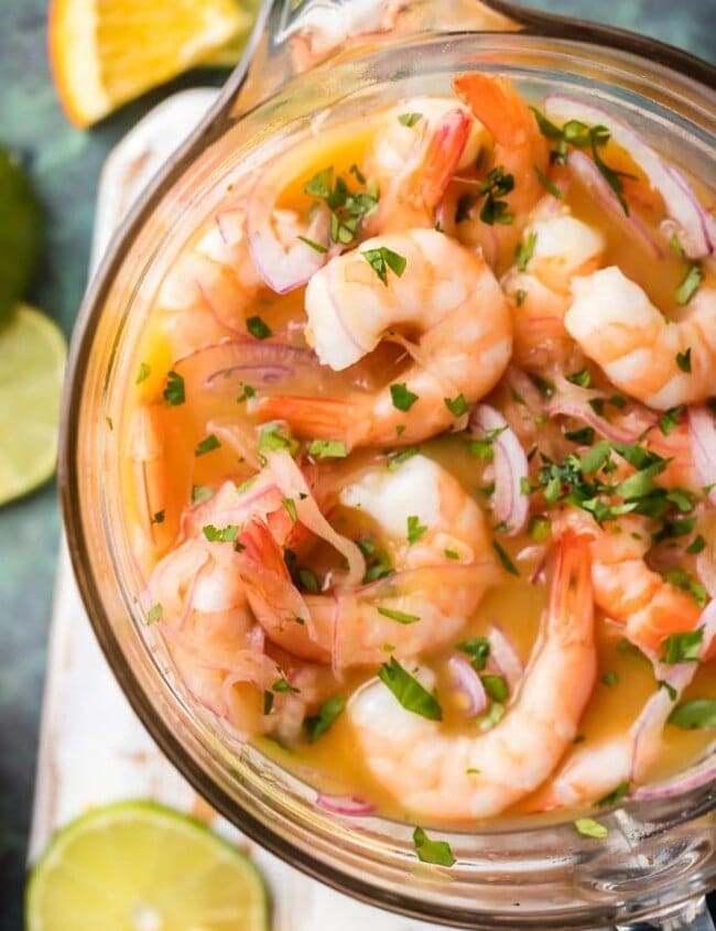Shrimp Ceviche (Ceviche de Cameron) is a fresh and delicious seafood appetizer. This CEVICHE STYLE SHRIMP COCKTAIL is our favorite light and healthy appetizer for the holidays. This gorgeous seafood starter is bursting with flavor and sure to please. This Shrimp Ceviche Recipe is ULTIMATE NYE APPETIZER!