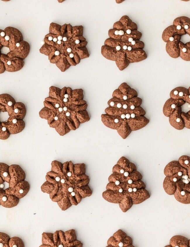 Spritz Cookies are a must make for Christmas. You'd never guess that these CHOCOLATE SPRITZ COOKIES are GLUTEN FREE! Utterly delicious, like little heavenly brownie bites. This Spritz Cookie Recipe is the ultimate EASY Christmas cookie recipe!