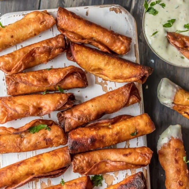 I could eat 50 of these MINI GREEN CHILE CHEESY BEAN TAQUITOS! I just can't get enough. Such a fun and easy appetizer for the holidays or game day. These are always a crowd pleaser.