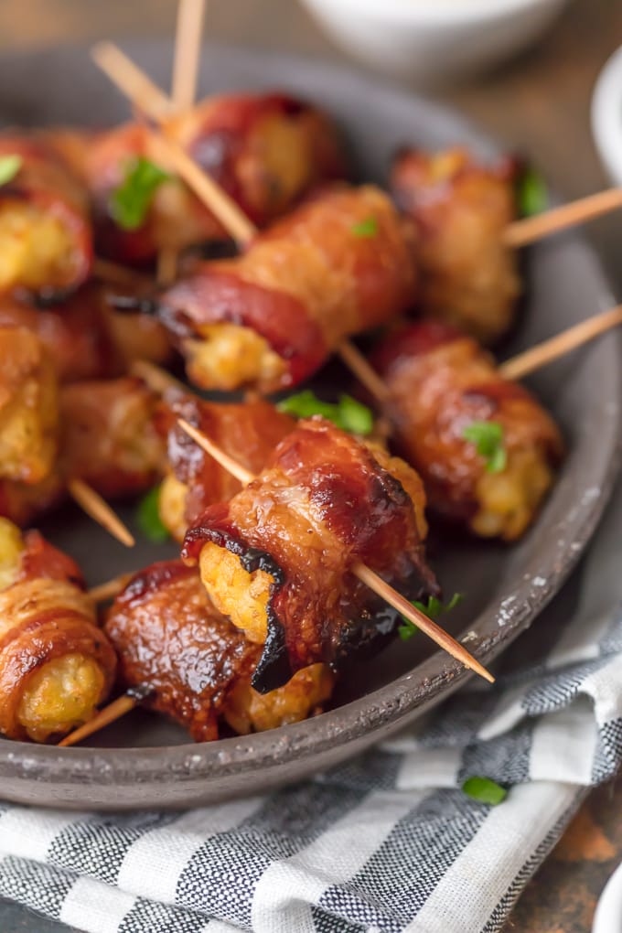 Tater tots wrapped in bacon in a stick