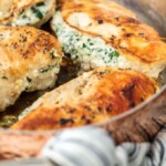 Spinach Stuffed Chicken Breast is a 3 INGREDIENT CHICKEN RECIPE that's healthy (around 400 calories), made in under 30 minutes, and done in just ONE PAN! This Spinach Stuffed Chicken Breast is one of our all-time favorite Stuffed Chicken Breast Recipes. Cheesy, delicious goodness.