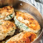 This 3 INGREDIENT SPINACH DIP STUFFED CHICKEN is healthy(er), made in under 30 minutes, and done in just ONE PAN! It doesn't get easier, more flavorful, or more perfect. Cheesy delicious goodness. One of our favorite chicken recipes!