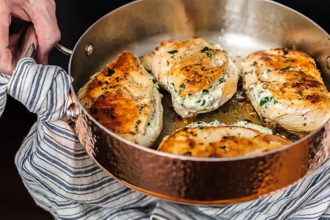 Spinach Dip Stuffed Chicken Breast in copper pan