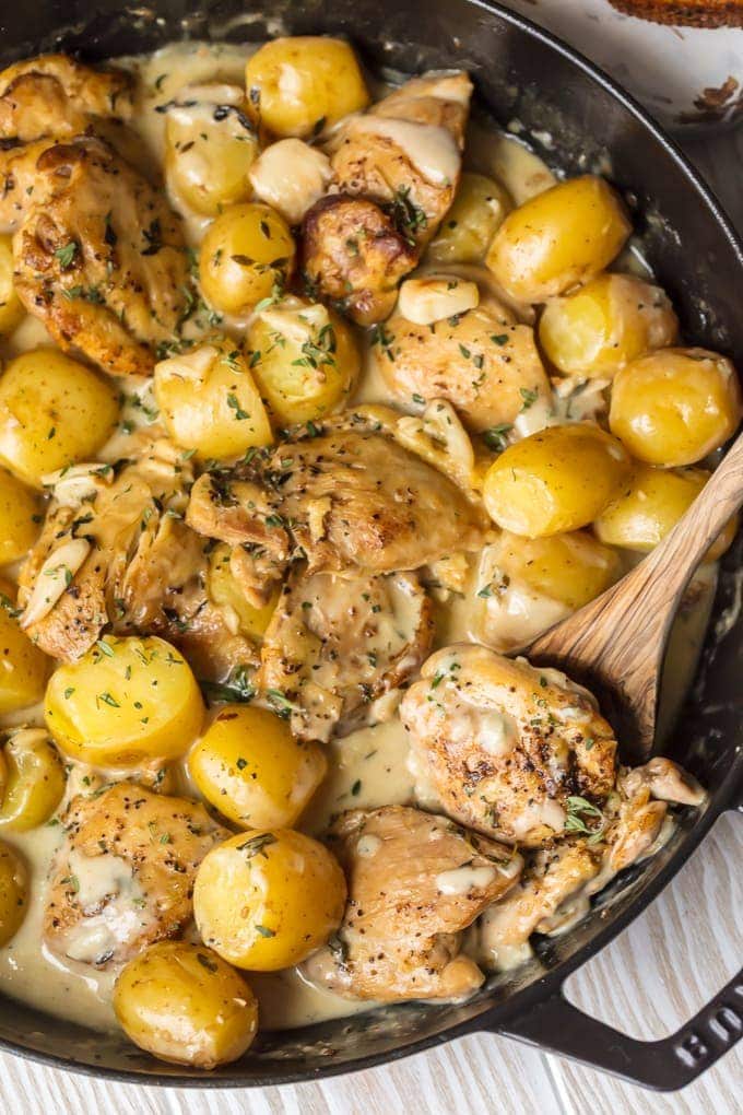 40 Clove Garlic Chicken and Potatoes with Cream Sauce cooking in skillet