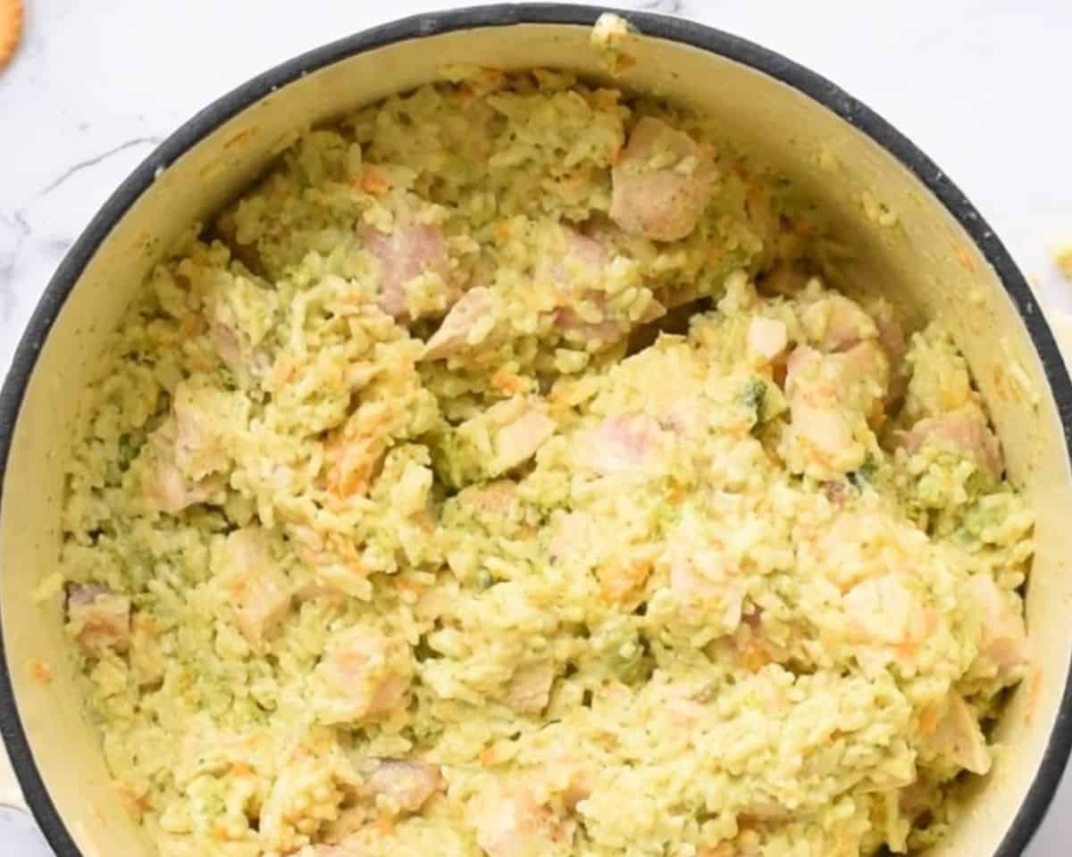 Mixing the casserole ingredients together.