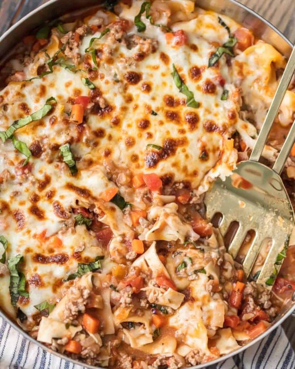 Weight Watchers lasagna with a spoon digging into it.