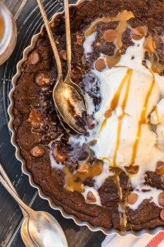 This GIANT COOKIE RECIPE is perfect for SHARING! Similar to those incredible skillet cookies you find at restaurants, our giant CHOCOLATE CARAMEL COOKIE recipe is the stuff dreams are made of! This is our favorite oh so decadent dessert to make for any and every celebration. Gooey chocolate caramel cookies for the win!