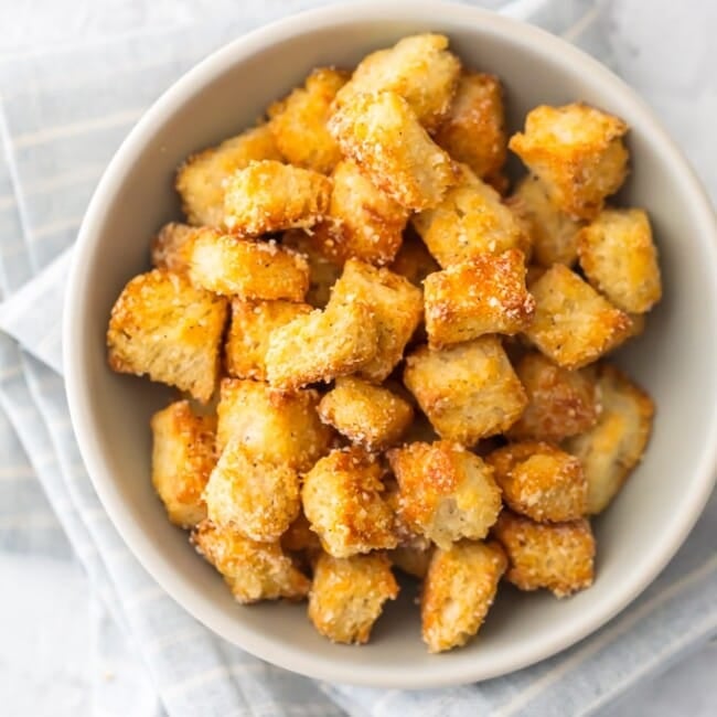 This HOMEMADE CROUTONS RECIPE is super simple.  Impress everyone including yourself with these HEALTHY BAKED CROUTONS! I love that these are BAKED and not fried, making them a healthier alternative to this classic recipe. They're the perfect way to take any salad from good to great. 