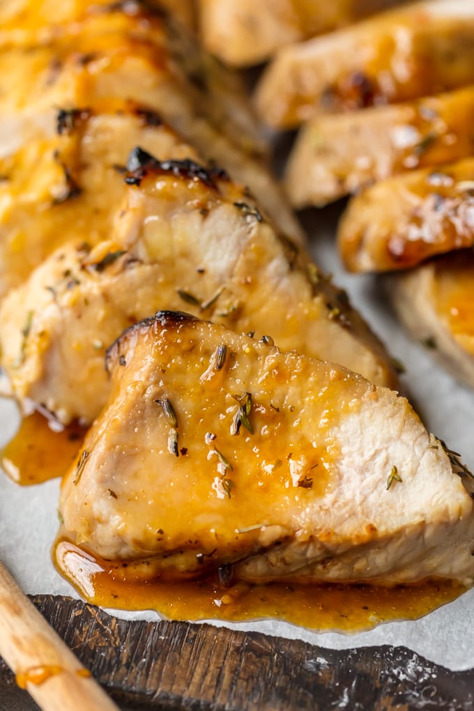 up close photo of herb roasted pork tenderloin with honey