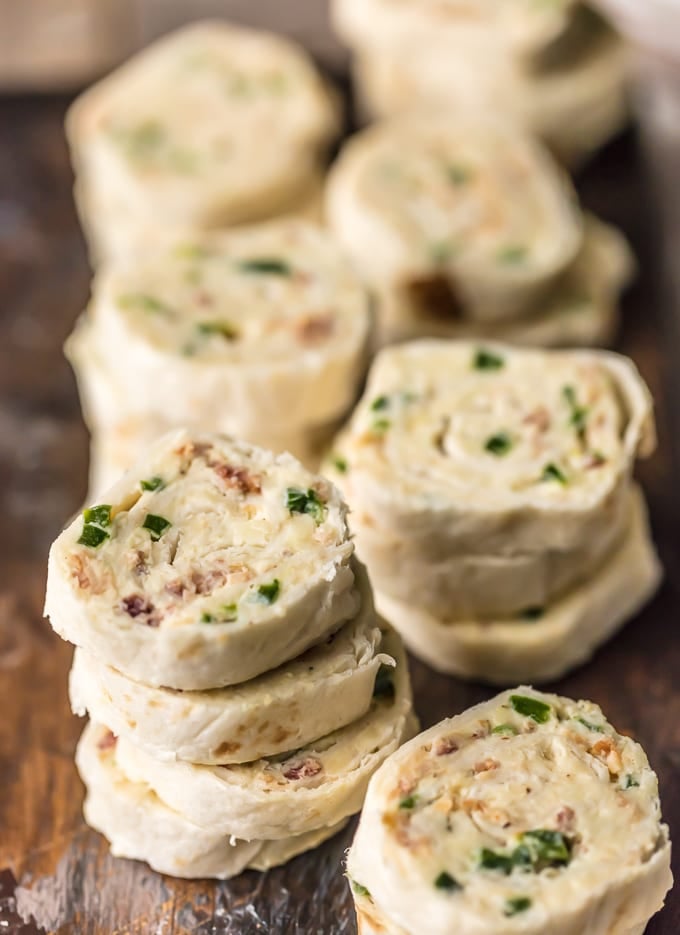Stacks of tortilla roll ups with cream cheese and jalapeno