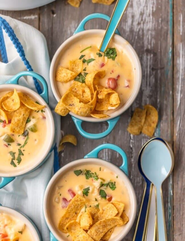 This MEXICAN CHEESY CHICKEN CHOWDER RECIPE is the ultimate Winter comfort food soup! Loaded with spicy tomatoes, green peppers, hash brown potatoes, garlic, onion, CHEESE, and more, this was an instant favorite at our house. Serve this cheesy chicken chowder with Fritos or tortilla chips and you're in business. SO GOOD.