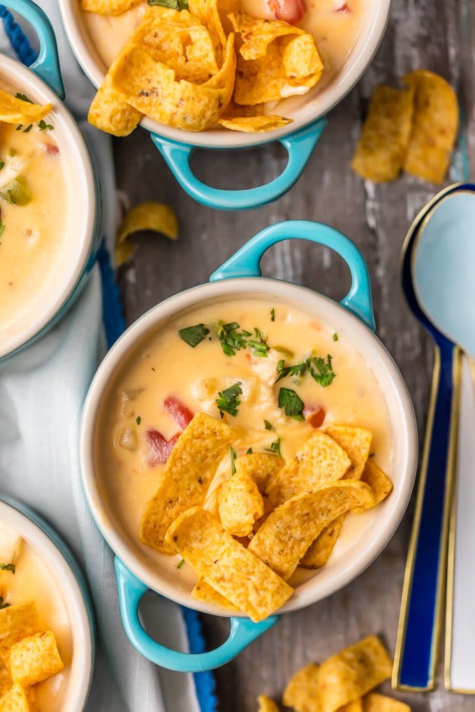 Small bowls of cheesy chicken chowder and corn chips