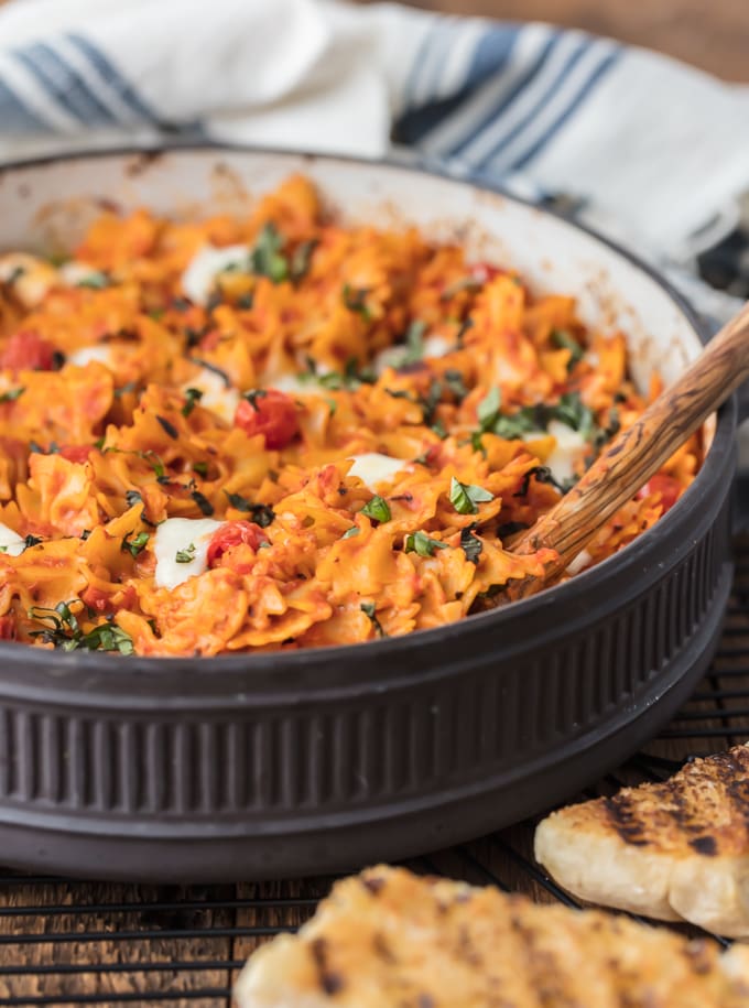 pasta in a dish with wooden spoon