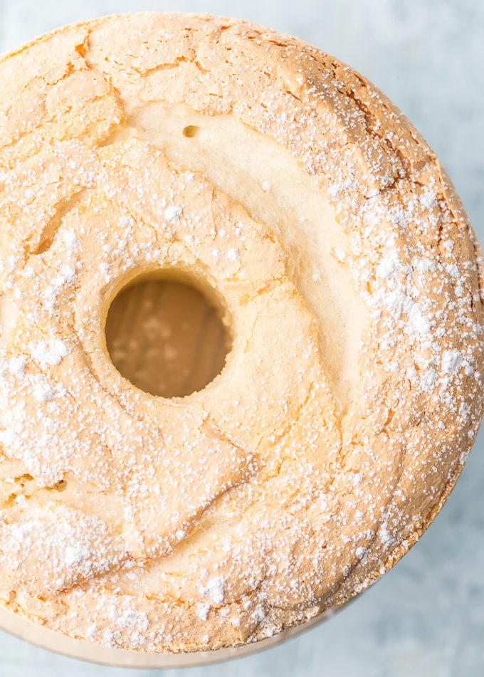 top view of angel food cake with powdered sugar dusting