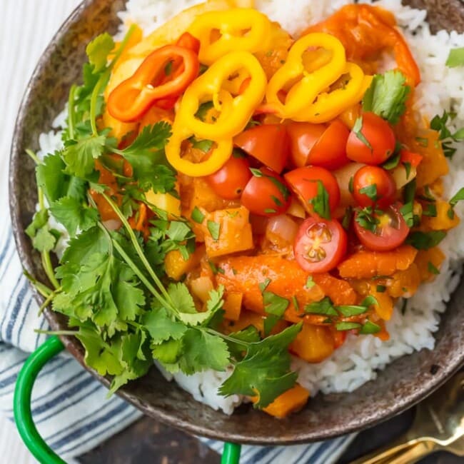 VEGETABLE CURRY is the perfect fresh and light vegetarian meal for these cooler temps! This Thai Curry Recipe has just the right amount of spice and all the colors of the rainbow make up this meal inspired by Indian flavors that the entire family will devour. If you've wondered how to make vegetable curry, it's so much easier than you might have thought. This recipe is great for meal planning!