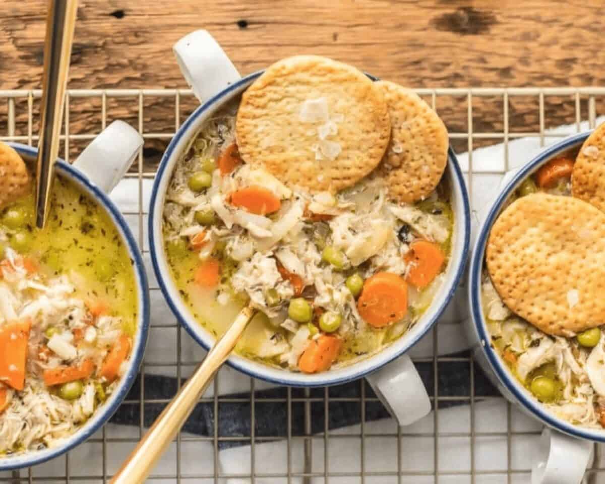 chicken pot pie soup served in a bowl with a spoon