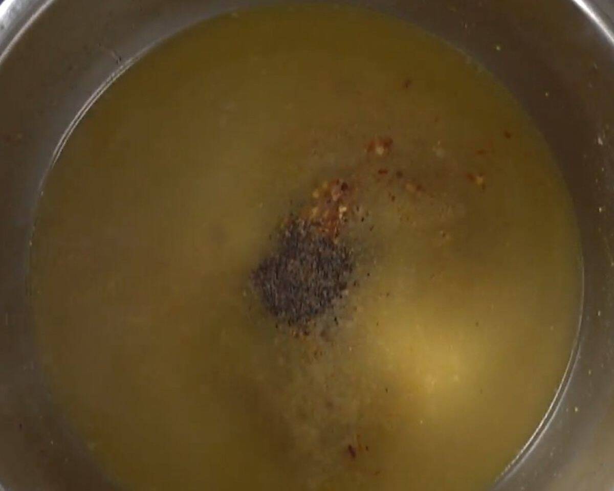 Deglazing the pan and adding seasoning.