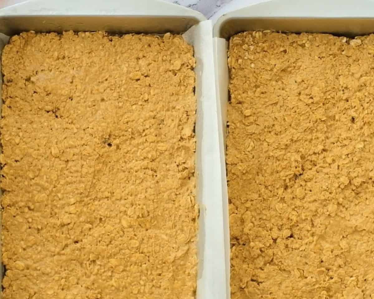 Laying the dough in the pans.