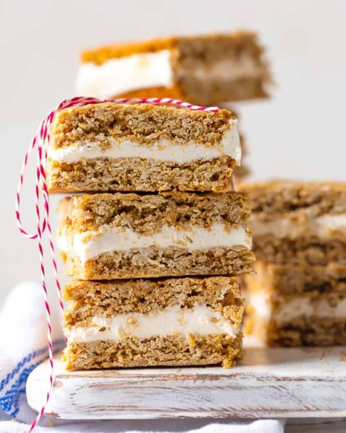 A stack of oatmeal cream pie bars tied with a red and white string.