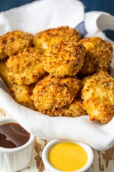 Baked Chicken Nuggets are a must make for any busy family. These BAKED EXTRA CRISPY PARMESAN CHICKEN NUGGETS will blow your mind and become an instant family favorite. Made healthier by baking instead of frying, you'll never miss the grease. Kids and adults will be requesting these flavorful Homemade Chicken Nuggets again and again!