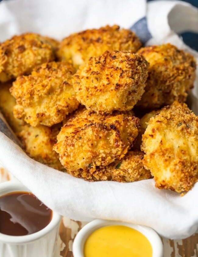Baked Chicken Nuggets are a must make for any busy family. These BAKED EXTRA CRISPY PARMESAN CHICKEN NUGGETS will blow your mind and become an instant family favorite. Made healthier by baking instead of frying, you'll never miss the grease. Kids and adults will be requesting these flavorful Homemade Chicken Nuggets again and again!