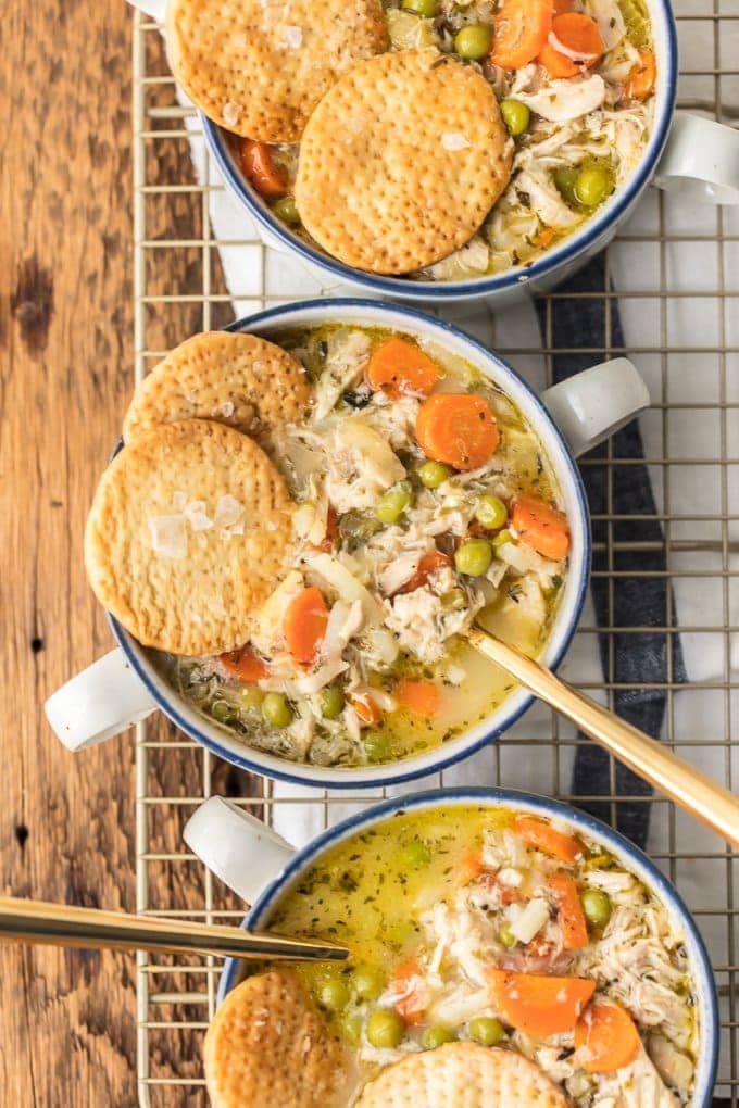 chicken pot pie soup in bowls with crackers