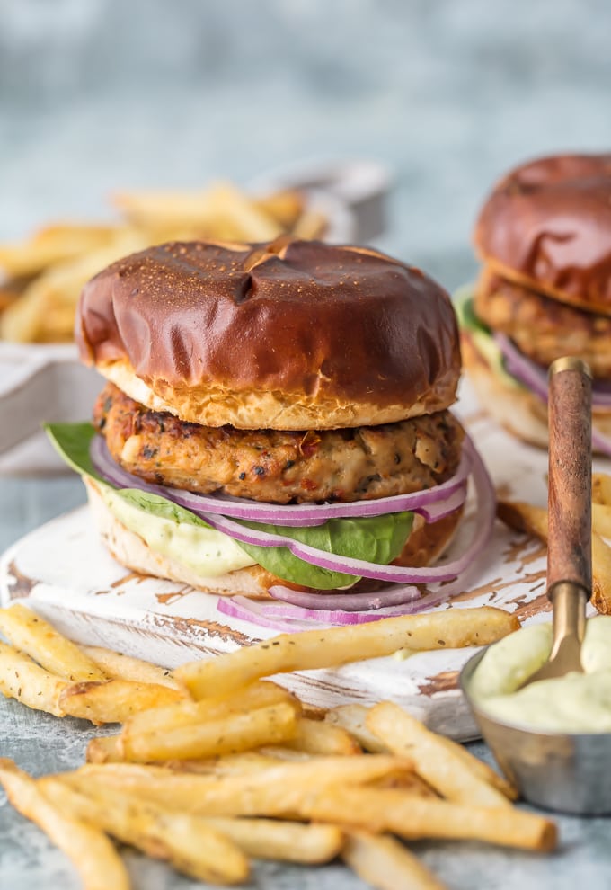 grilled chicken burgers with pretzel bun and pesto mayo