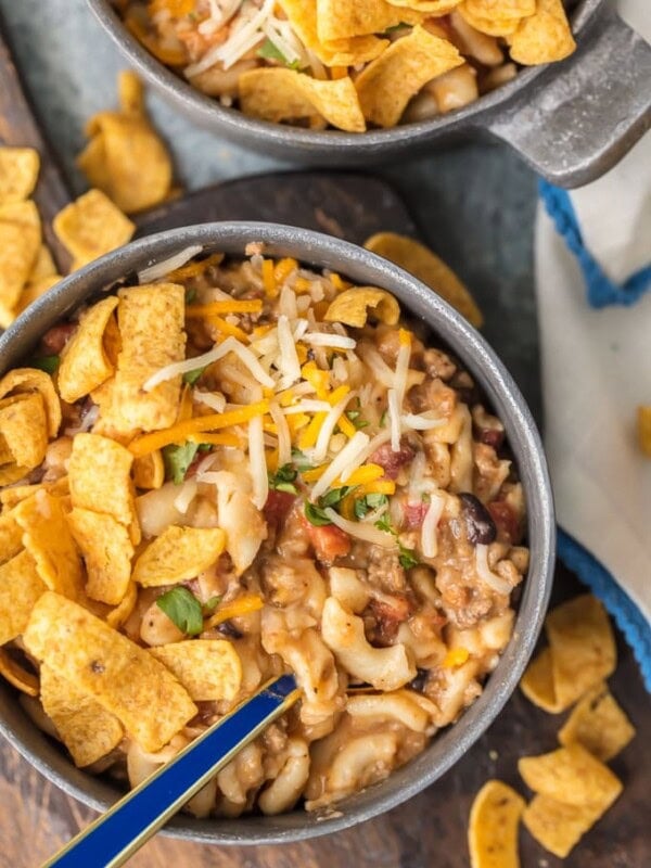 Instant Pot Chili Mac will be your new go-to favorite comfort food! This Chili Mac Recipe is loaded with beef, cheese, beans, tomatoes, and more, kids and adults alike will be back for seconds. We love to top ours with fritos, sour cream, and more cheese. There's nothing like a bowl of Chili Mac and Cheese on a chilly night. 