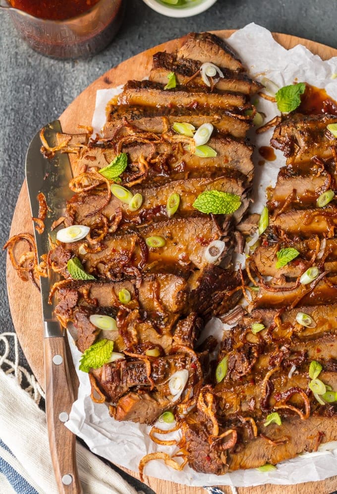 sliced brisket on a wooden cutting board