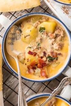 Instant Pot Zuppa Toscana is my new go-to Instant Pot Recipe! Every time we go to Olive Garden I get Zuppa Toscana and I just love that I can make this DELICIOUS copycat recipe at home in under 30 minutes! We first fell in love with this hearty and creamy soup at Olive Garden but I love this quick pressure cooker version even more. This Zuppa Toscana Recipe is loaded with sausage, bacon, potatoes, spinach, and so much flavor.