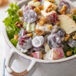 Waldorf Salad with Poppyseed Dressing is a delicious, fresh, and healthy twist on a classic side dish. There's something about a Waldorf Salad; fresh fruit, creamy dressing, and crunchy candied walnuts that makes this easy recipe a family favorite for every holiday, especially Easter! I love the addition of Poppyseed dressing for some extra zip and creaminess.