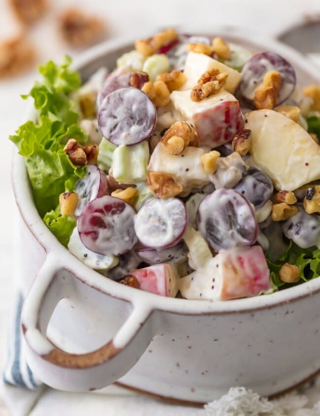 Waldorf Salad with Poppyseed Dressing is a delicious, fresh, and healthy twist on a classic side dish. There's something about a Waldorf Salad; fresh fruit, creamy dressing, and crunchy candied walnuts that makes this easy recipe a family favorite for every holiday, especially Easter! I love the addition of Poppyseed dressing for some extra zip and creaminess.