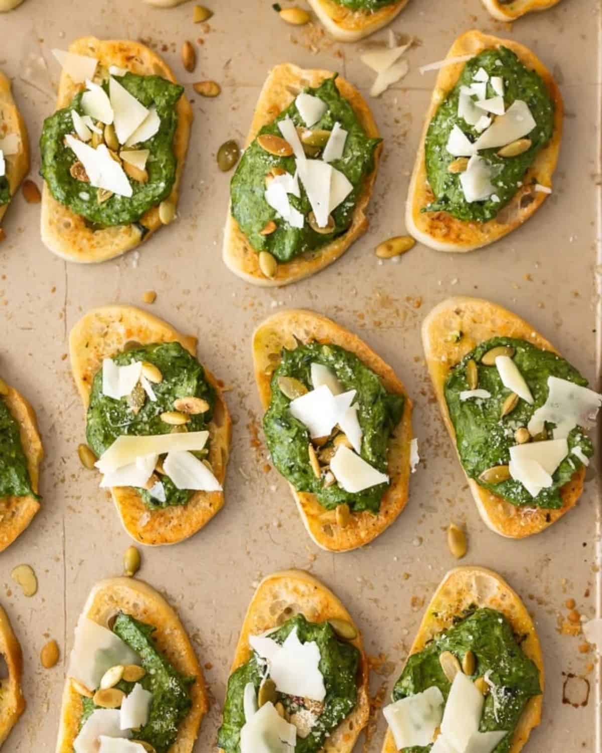 Creamy Spinach Dip Crostini is such a classy and unique appetizer to serve at your next party. Cheesy Spinach Dip is loved by all, and now you don't need the chips to enjoy! Warm Spinach Parmesan Dip piled onto toasty French Bread makes the ultimate crostini appetizers.