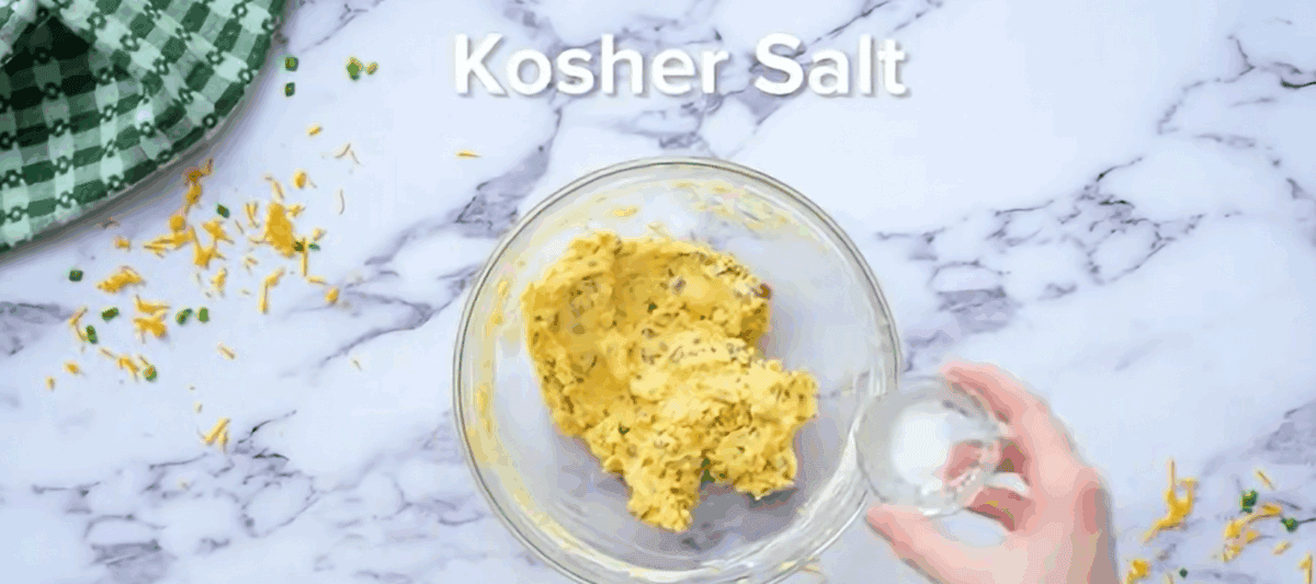 Making the egg yolk mixture in a glass bowl.