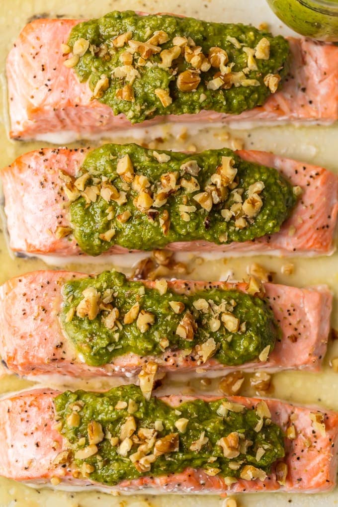 salmon fillets topped with pesto and walnuts