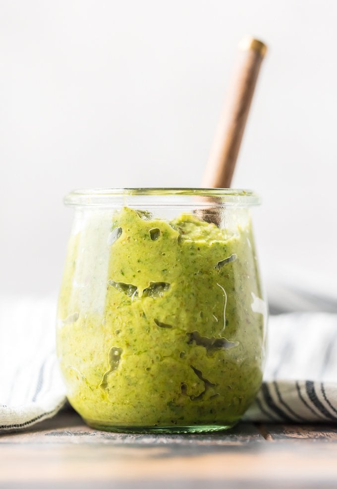 A jar of walnut basil pesto sauce