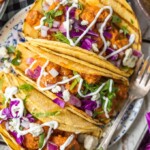This BUFFALO SHRIMP TACOS RECIPE is tossed in a finger lickin good creamy buffalo sauce and easier than you can even imagine. Perfect for Cinco De Mayo, family night in, or game night with friends! Nothing is better than spicy crispy popcorn shrimp topped with all the fixings and wrapped in a corn tortilla. I'm obsessed.