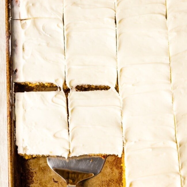 This CARROT CAKE BARS RECIPE has a secret ingredient, carrot baby food! You'll never believe how moist, simple, and delicious this EASY Carrot Cake can be. Try not to eat all the perfect cream cheese icing before piling it on and serving to your Easter guests. Best Carrot Cake Recipe ever!